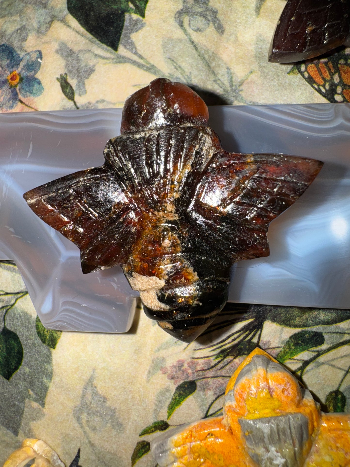 Carved amber bumblebees