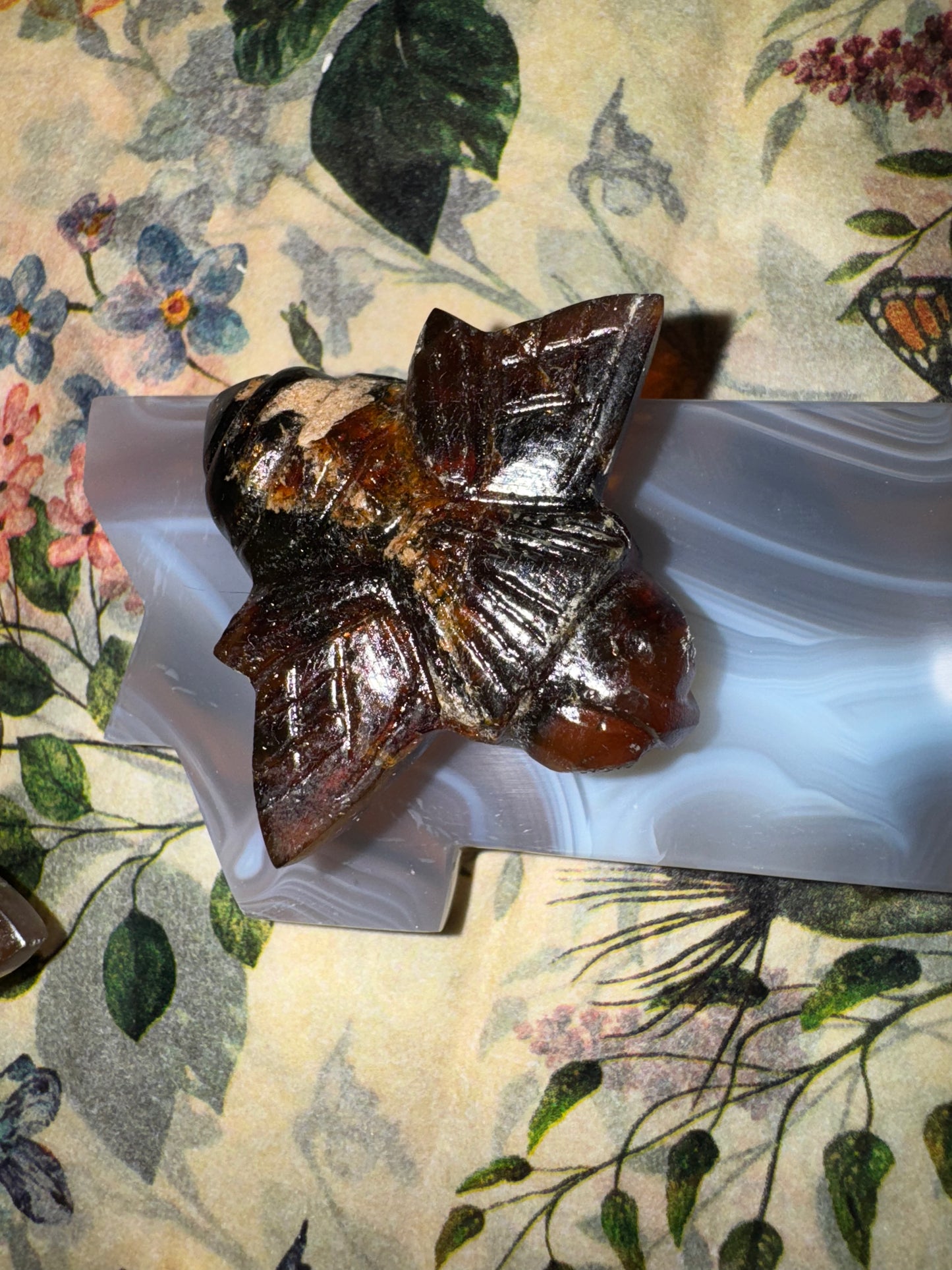 Carved amber bumblebees
