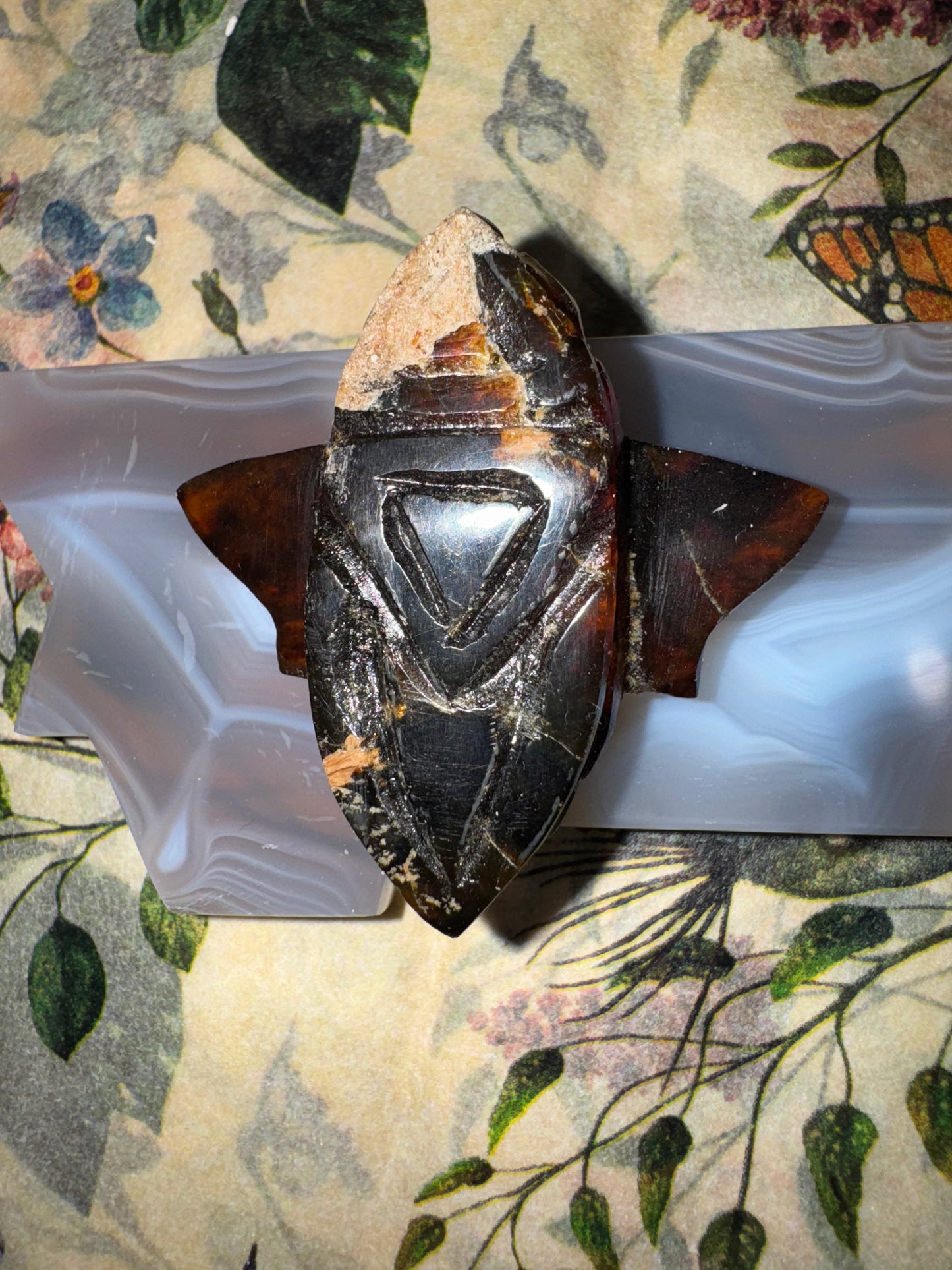 Carved amber bumblebees