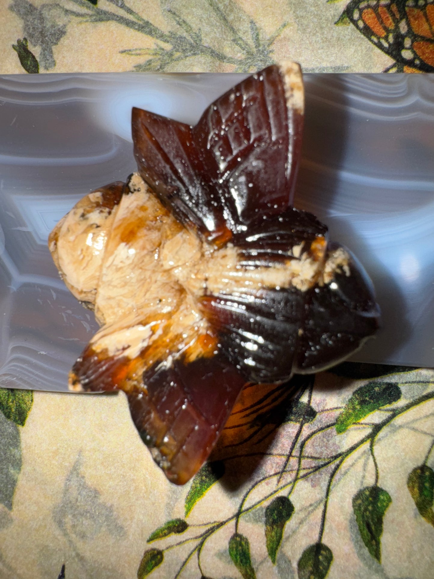 Carved amber bumblebees