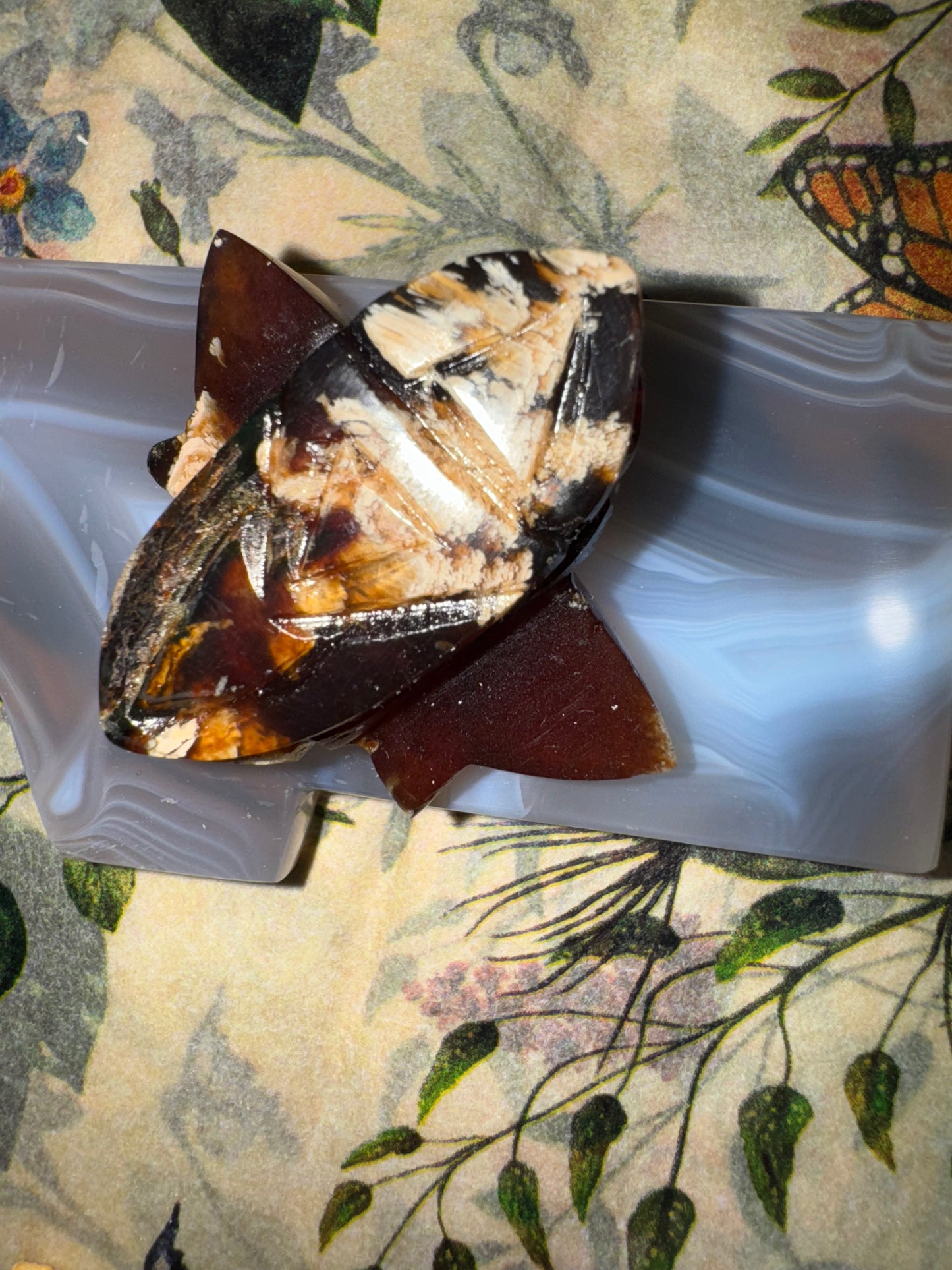 Carved amber bumblebees