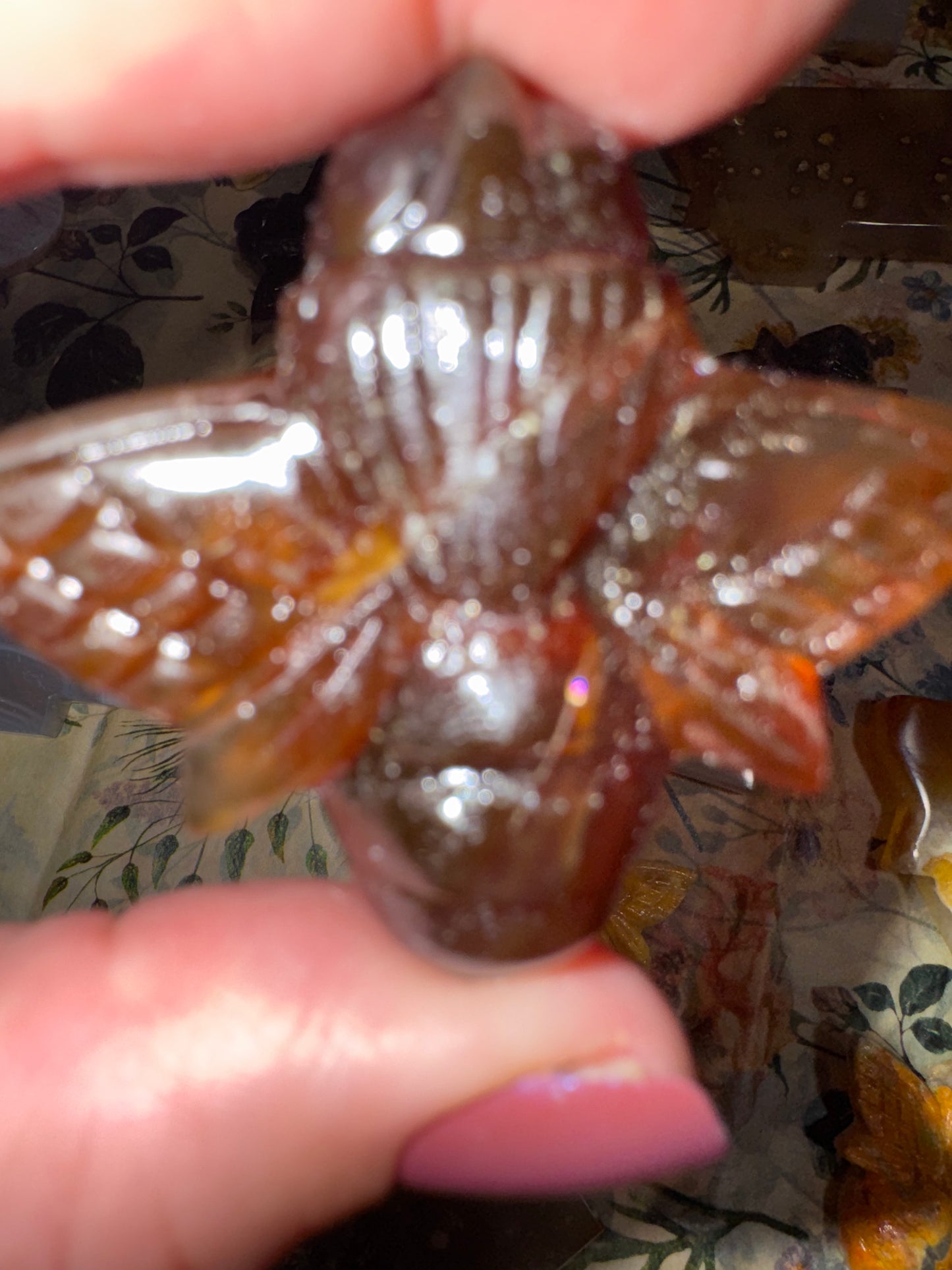 Carved amber bumblebees
