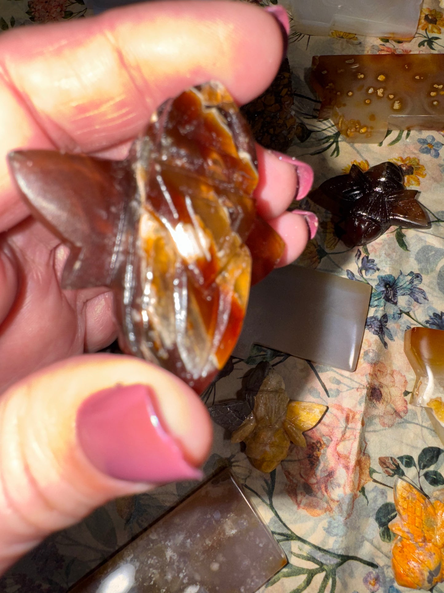 Carved amber bumblebees
