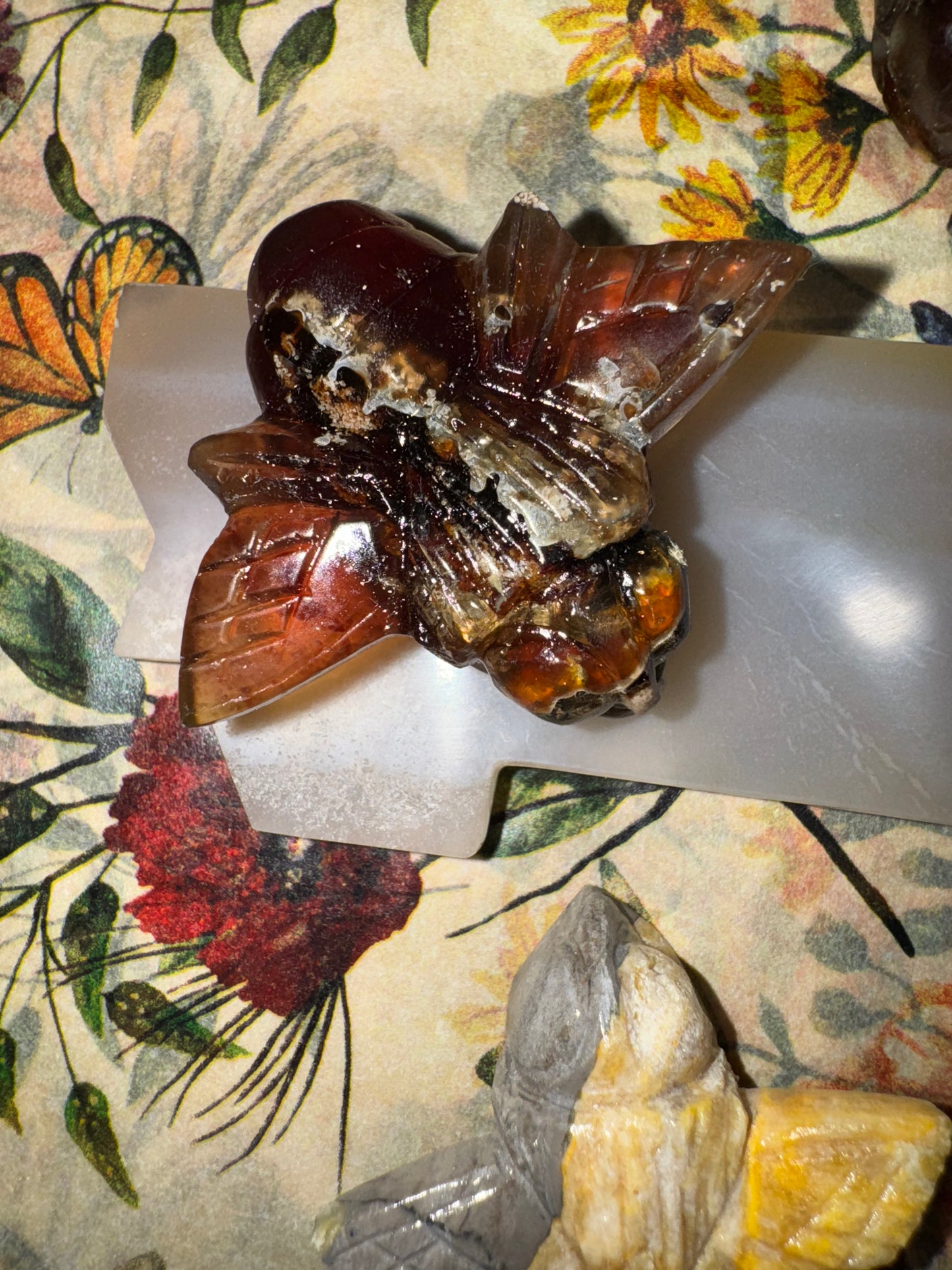 Carved amber bumblebees