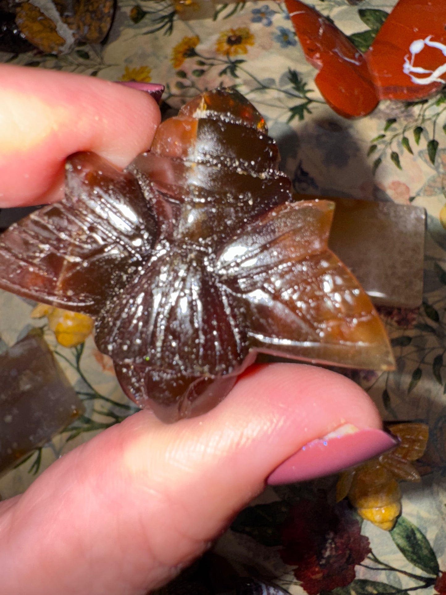 Carved amber bumblebees
