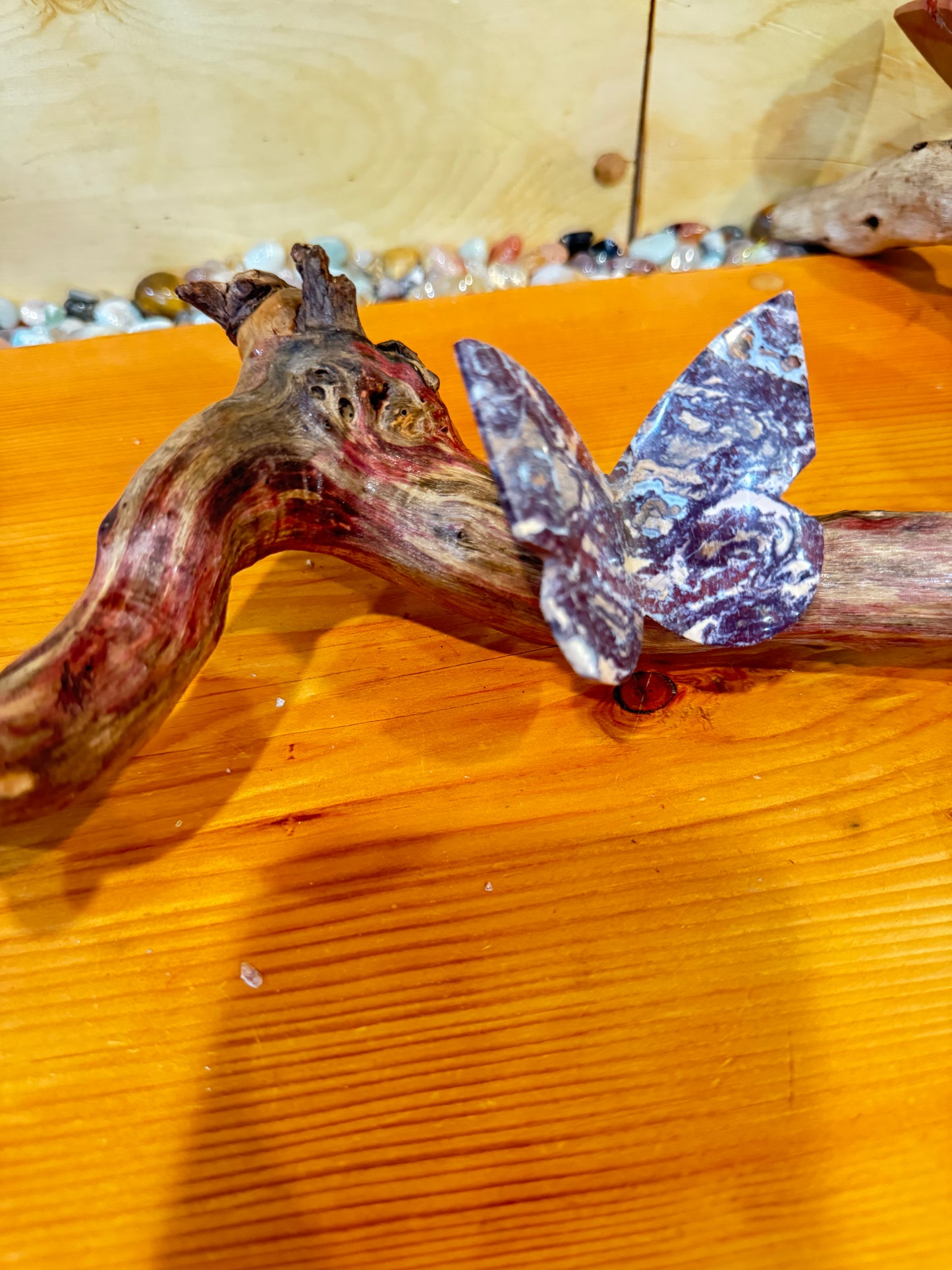 3 Stone butterflies fixed on a piece of drift wood