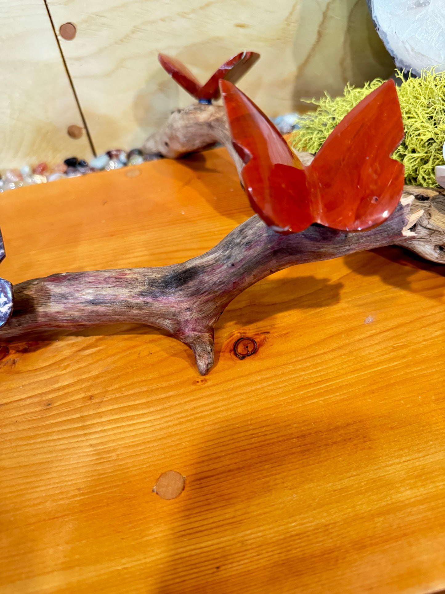3 Stone butterflies fixed on a piece of drift wood