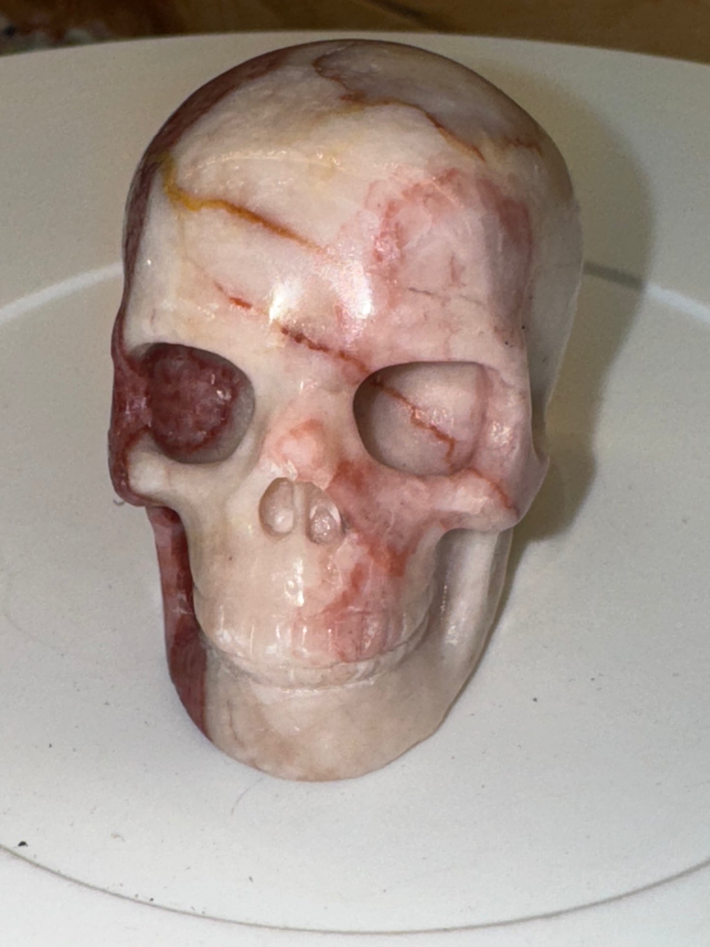 Pink banded calcite skull