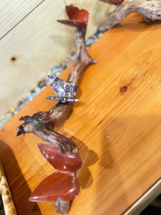 3 Stone butterflies fixed on a piece of drift wood